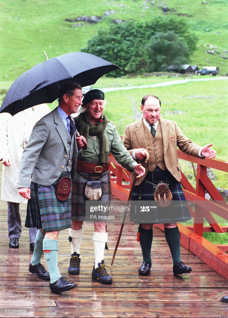 The Prince of Wales (left), Sir Jimmy Savile (centre), and deputy Lord lieutenant, Ian Thornber, share a joke after the prince arrived in Glencoe for a visit to the mountain rescue centre. (Photo by PA Images via Getty Images)